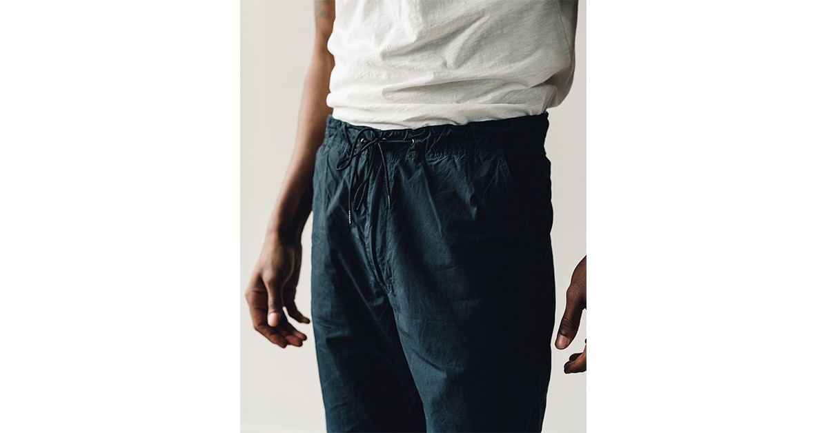 https://www.heddels.com/wp-content/uploads/2020/10/social-drawstring-tech-pants-five-plus-one-5-orslow-ripstop-new-york-pants-detailed.jpg